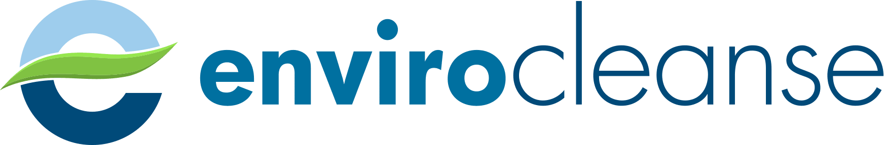 A tanker truck is driving down a highway next to a yellow truck.