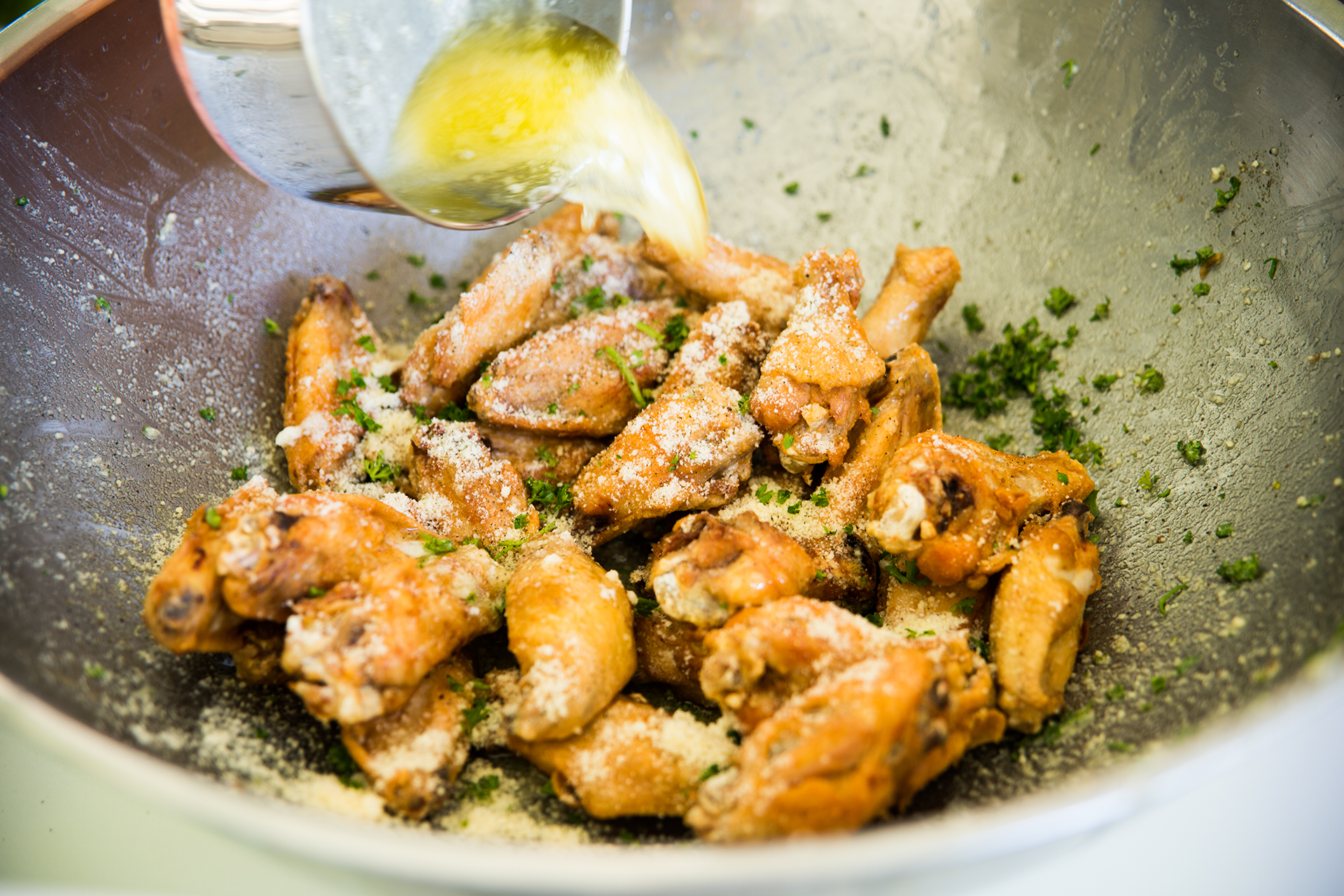 Savory chicken wings fried to crunchy perfection, seasoned with  parmesan , chives, and green onion for a flavorful dish.