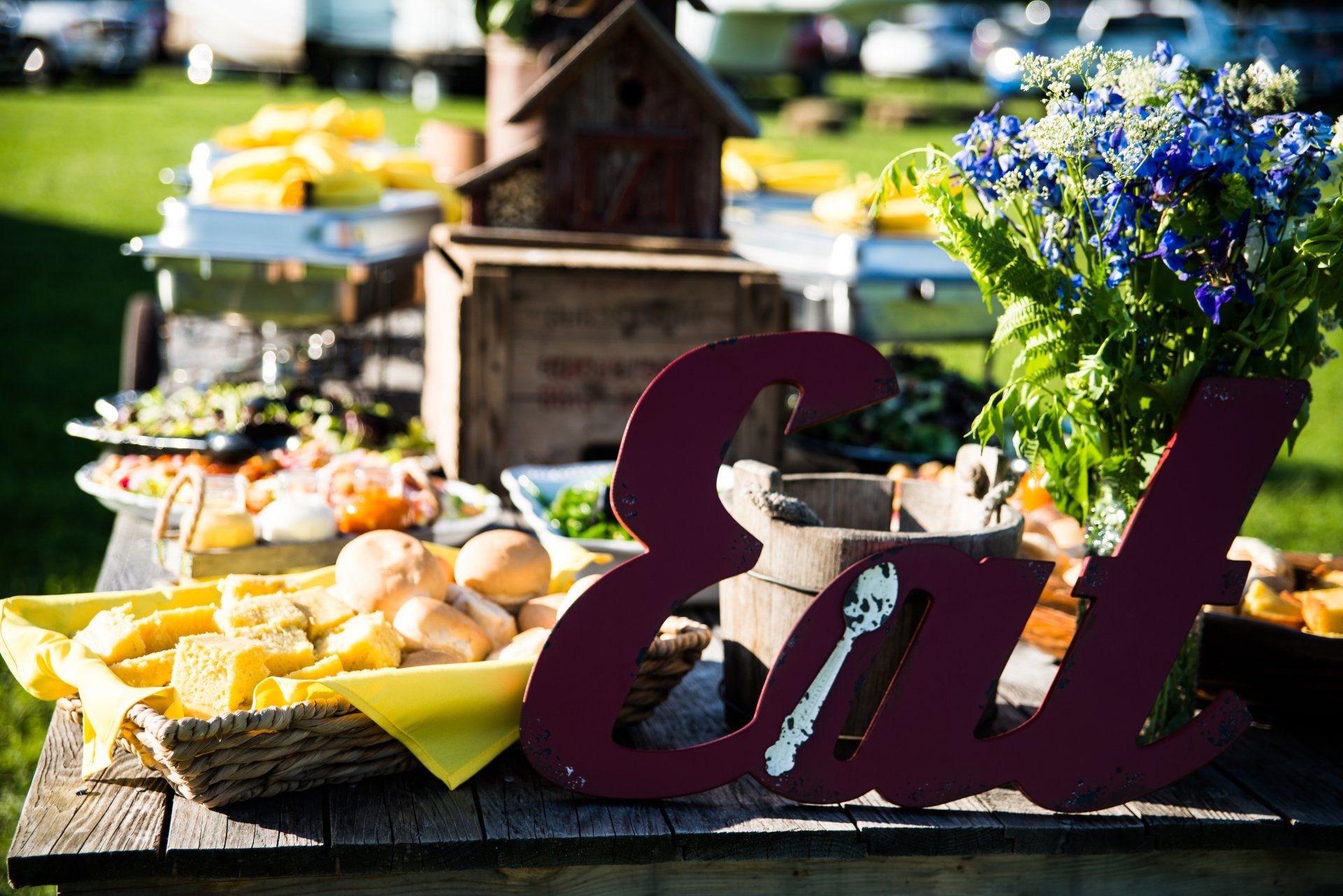 Luncheon table display with fresh fruits and  cheeses.  Accented with fresh fruit preserves, nuts, and breads.