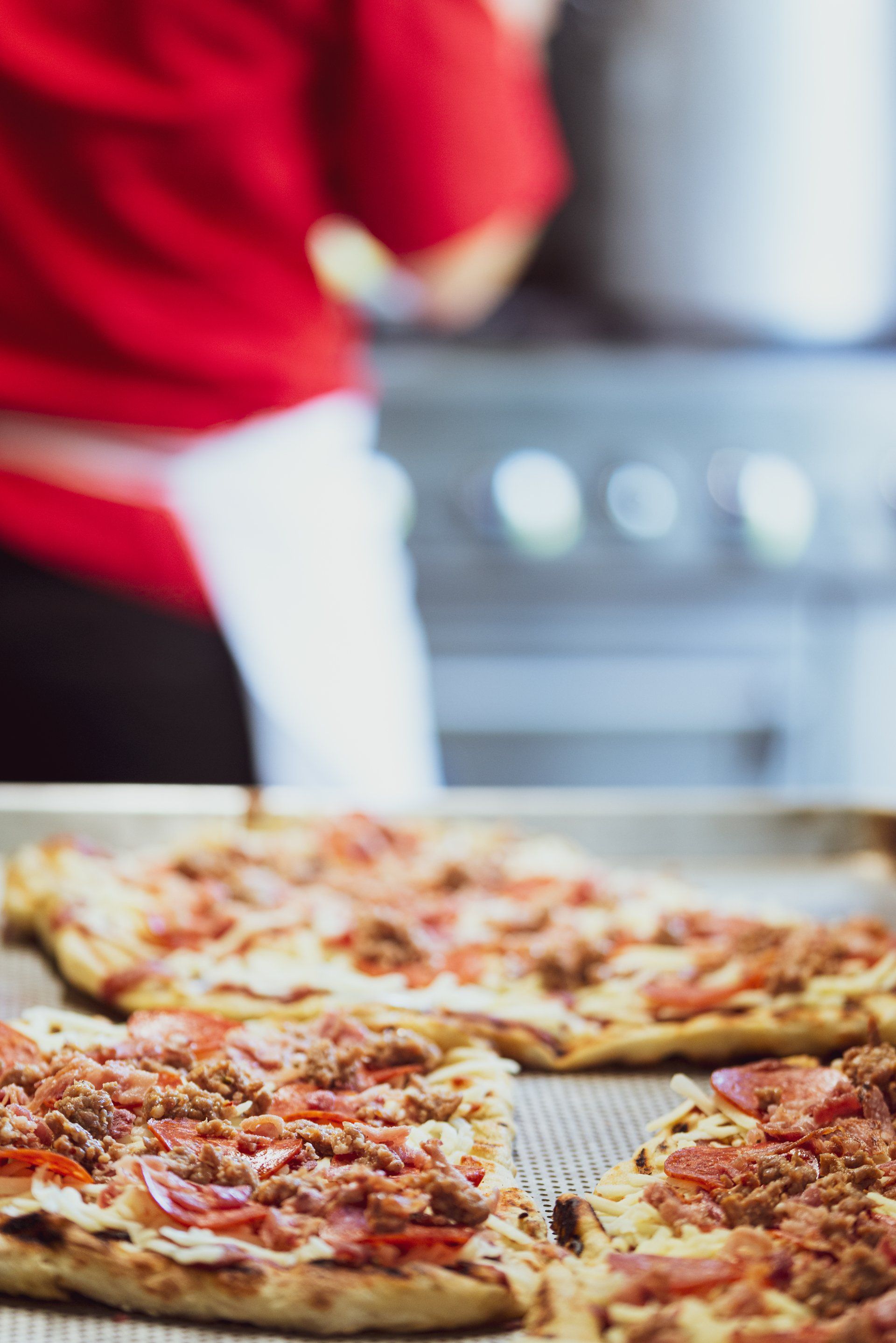 Luncheon cheeseboard with swiss and aged cheddar, gourmet crackers, fresh grapes and strawberries.