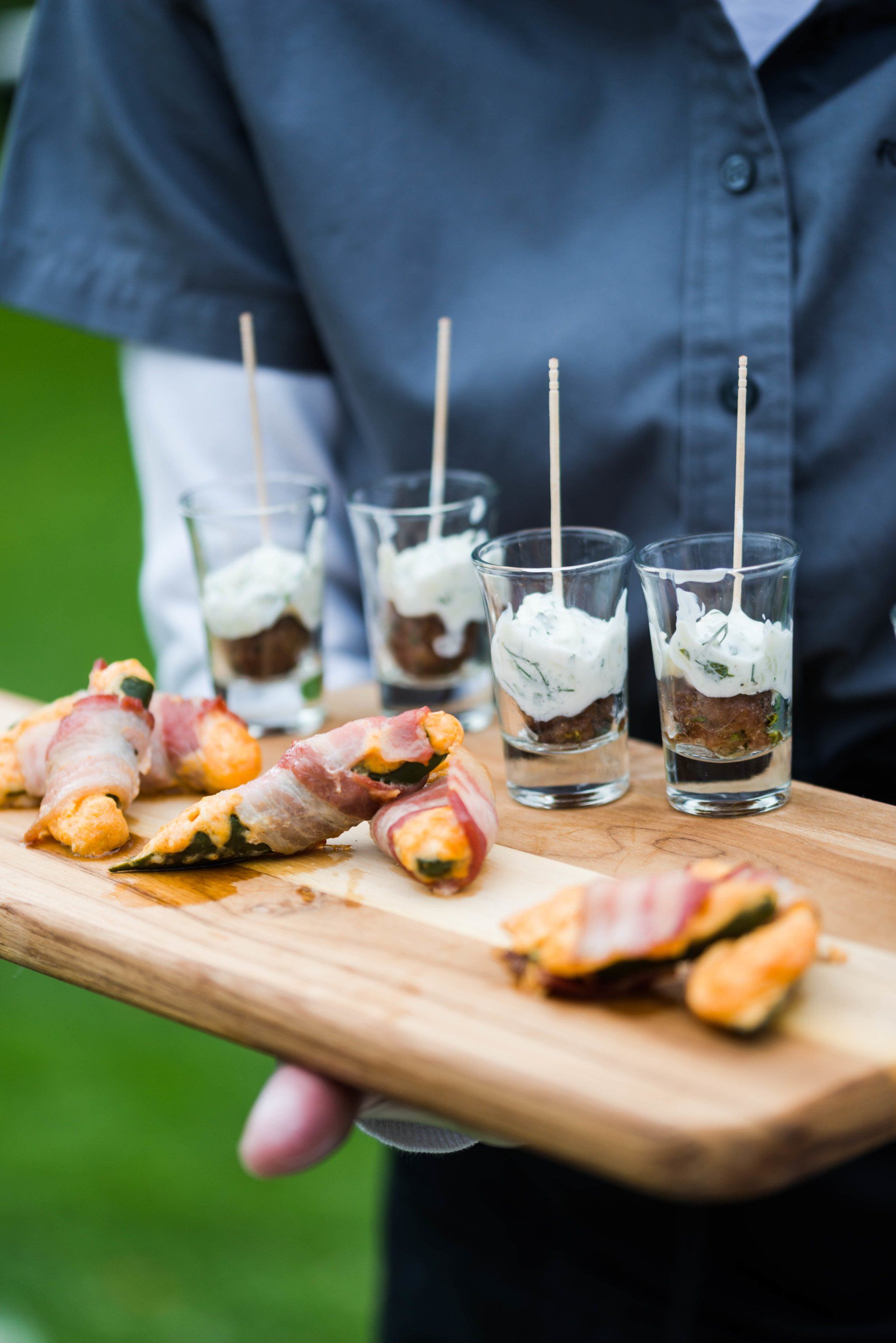 Baked jalapeno peppers wrapped in aged cheddar cheese and bacon.