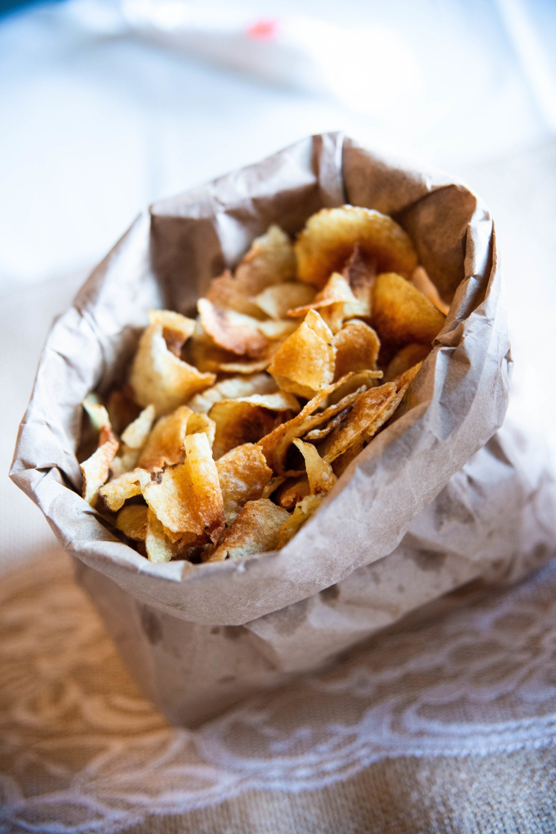 Freshly made potato chips seasoned with salt and black pepper