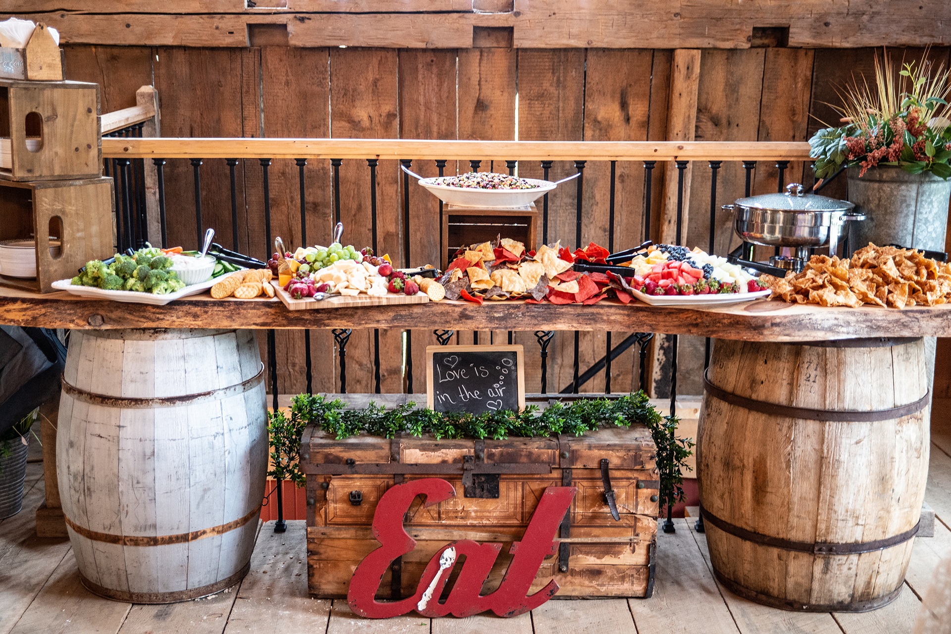 Luncheon table with fresh fruits, aged swiss, cheddar, and bleu cheeses.  Accented with fresh fruit preserves, nuts, and aged meats.