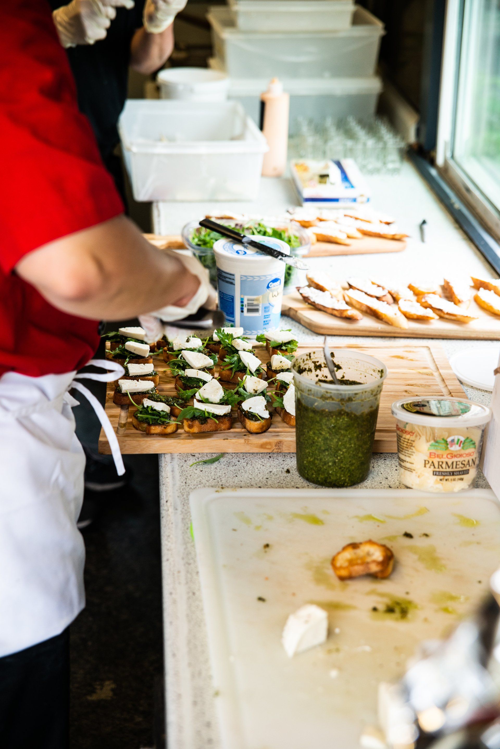 Toasted baguette with fresh bruschetta, pesto, mozzarella, and arugula.