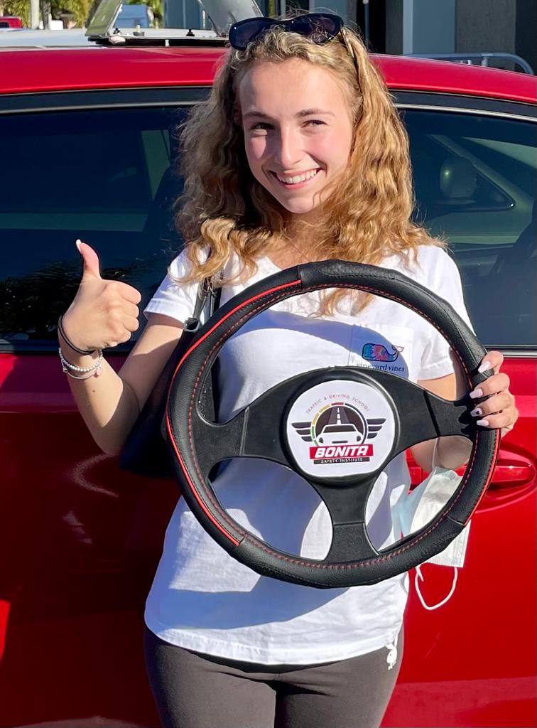 Young Woman Holding A Steering Wheel — Bonita Springs, FL — Bonita Safety Institute