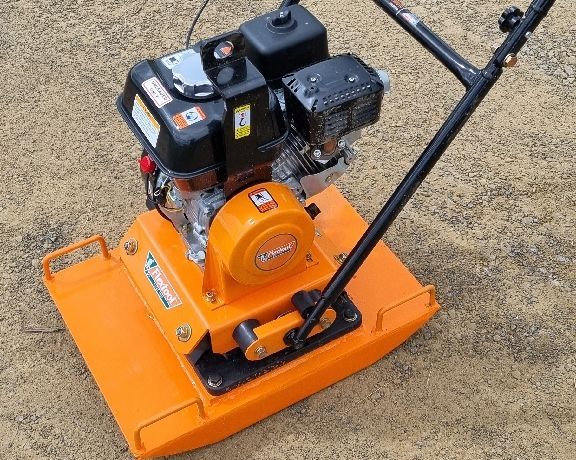 Brush Cutter Mower Lying on Lawn — Beaudesert Equipment Hire Services in Beaudesert, QLD