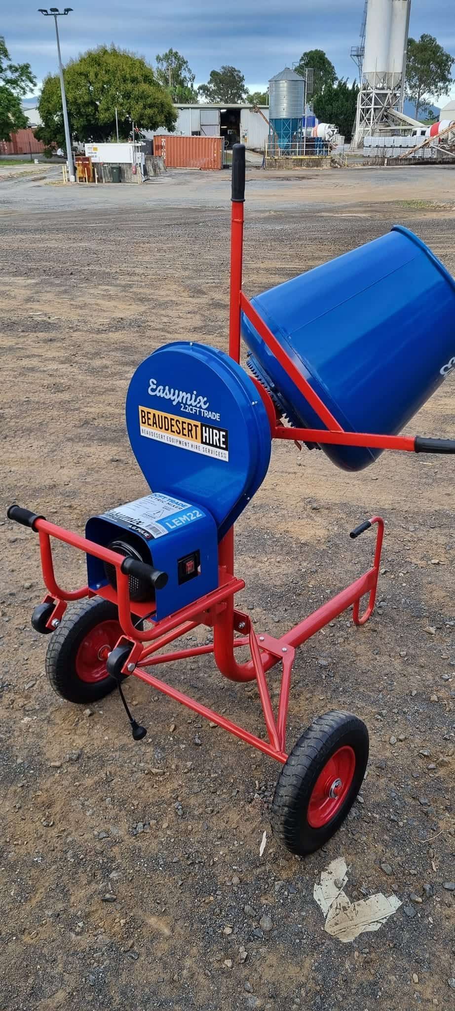 A blue barrel is sitting on top of a red cart. — Beaudesert Equipment Hire Services in Beaudesert, QLD