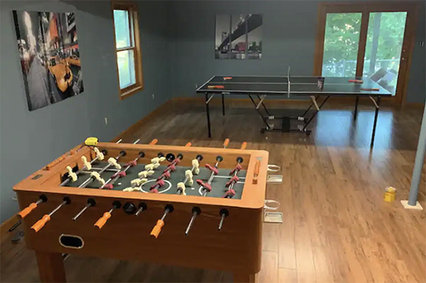 game room with foosball and ping pong