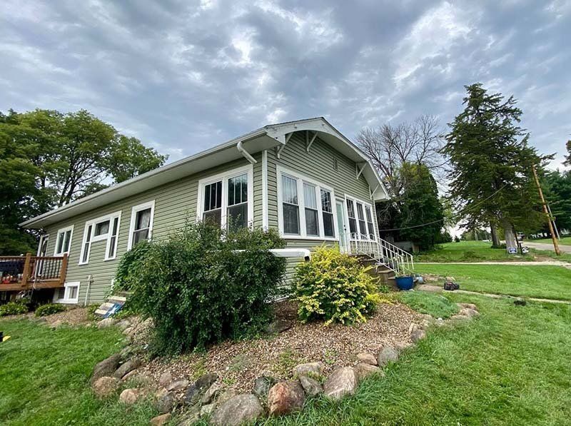 Side view of a white house — Cedar Rapids, IA — Baker Pro Construction, LLC