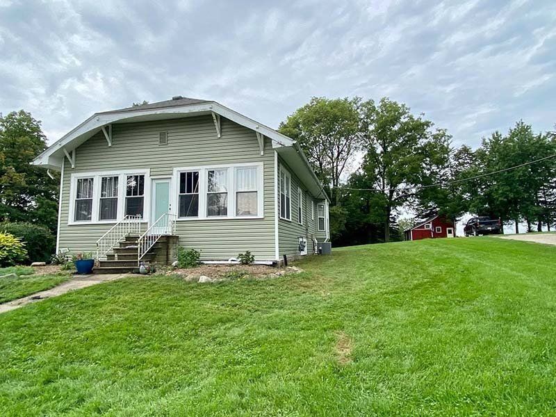 Front view of a white house — Cedar Rapids, IA — Baker Pro Construction, LLC