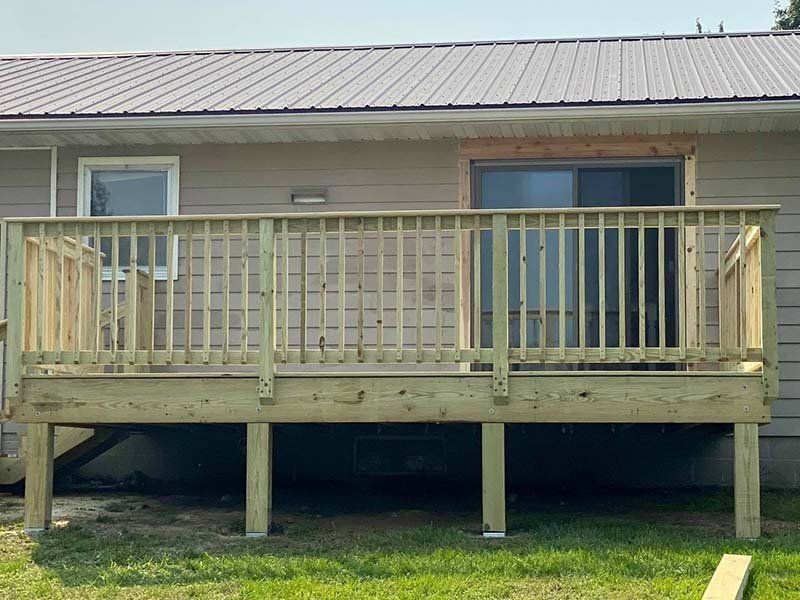 House with wooden deck — Cedar Rapids, IA — Baker Pro Construction, LLC