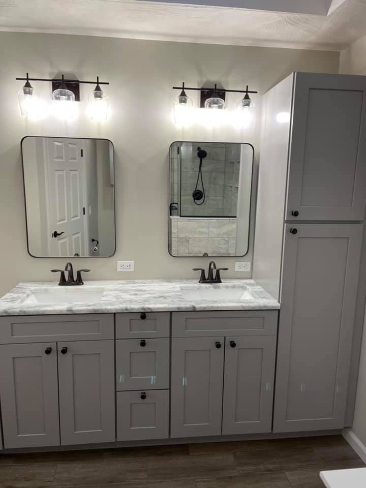 A bathroom with two sinks and two mirrors.