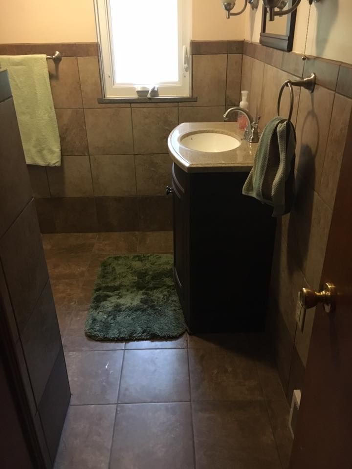 A bathroom with a sink and a window