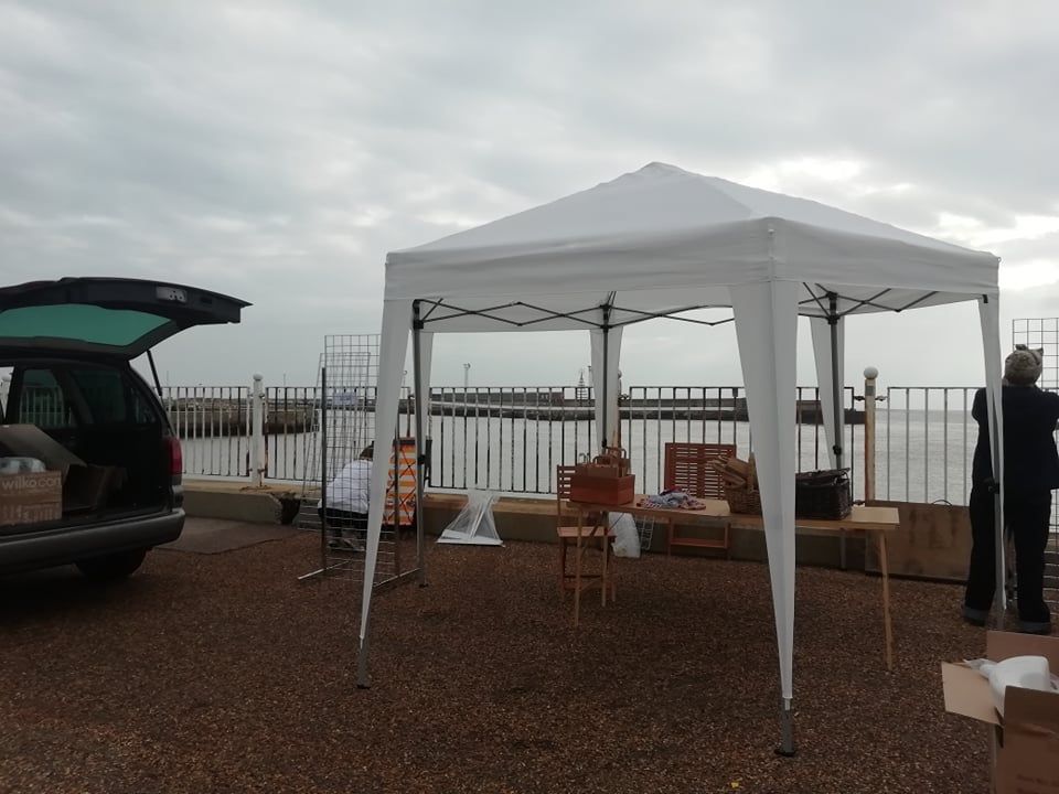The gazebo from the Another Angle Studio stall all set and finishing preperations for the event