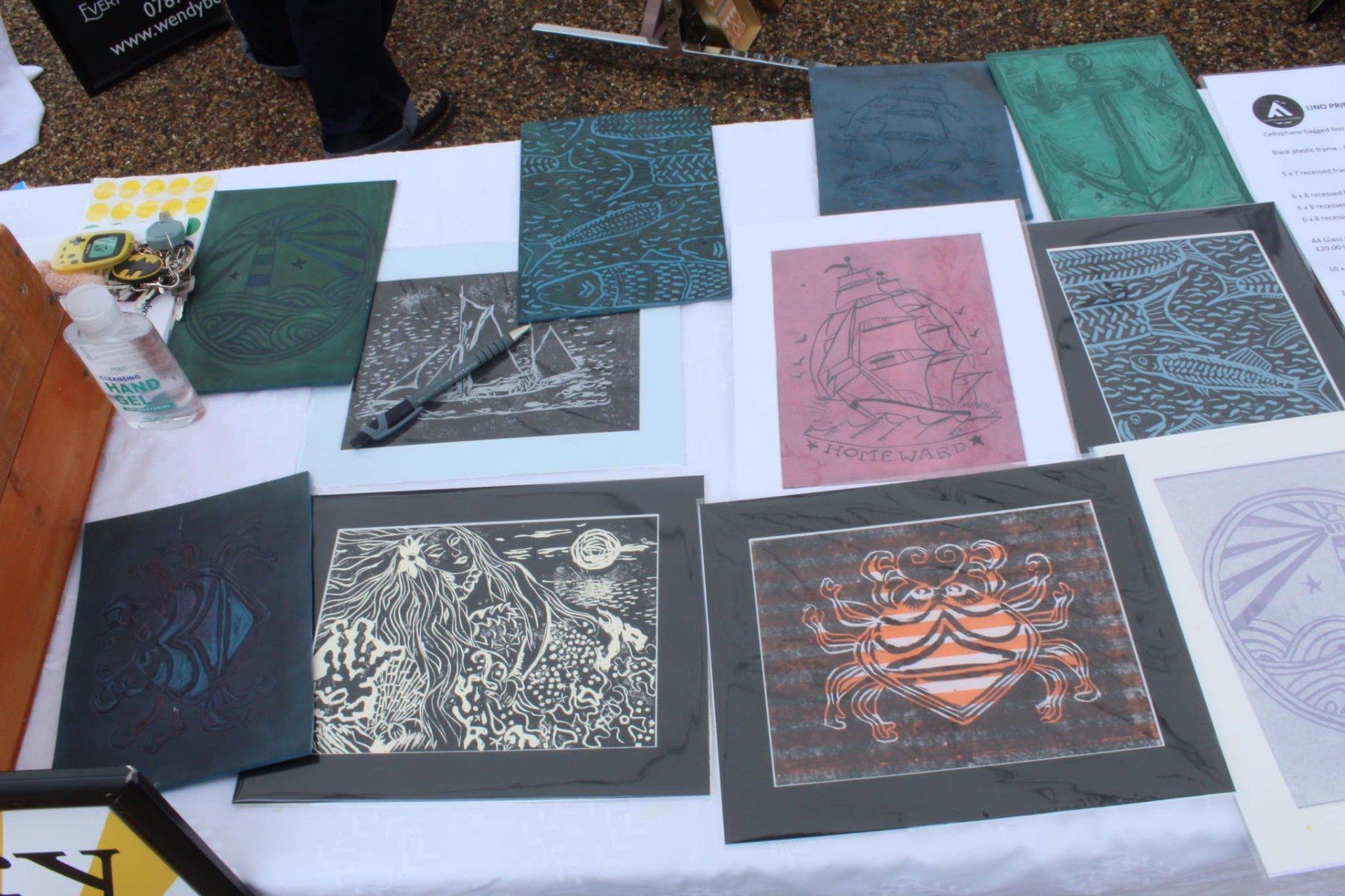A mix of the mounts to be sold as well as the lino cuts that were used to create the prints