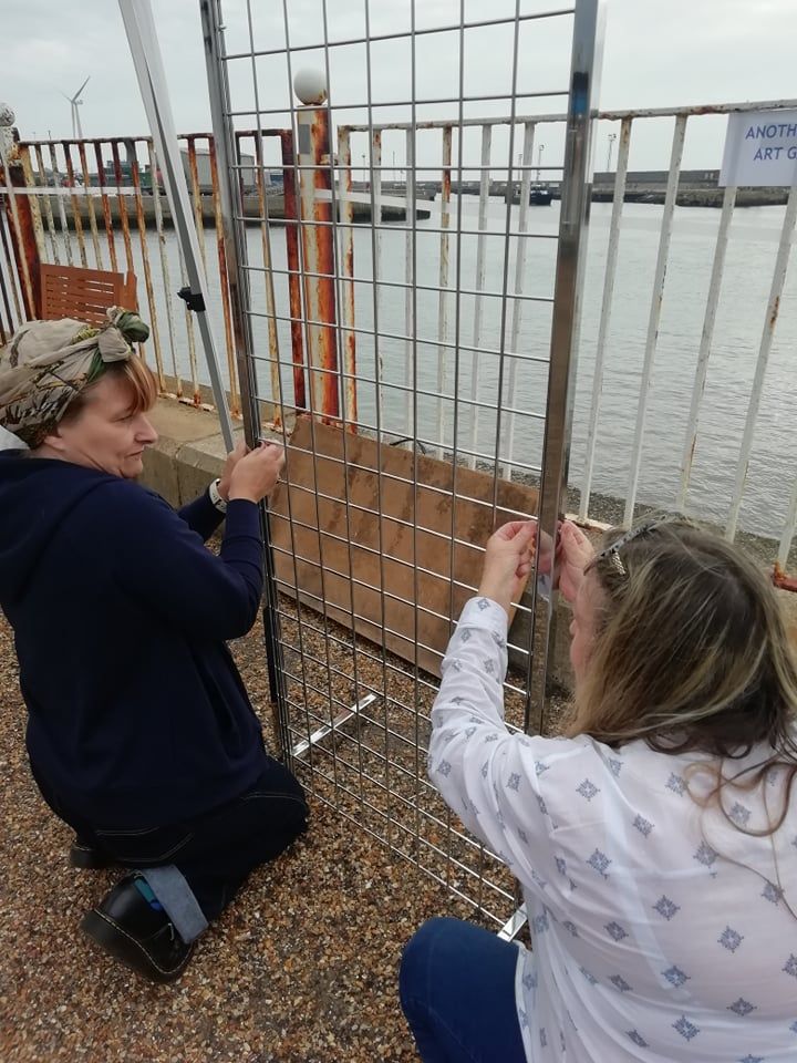 Maria and Victoria from Another Angle Studio building the iron stands to hang the prints