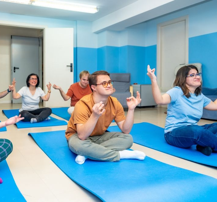Group Sitting On Mats Pilates Session — Ani's Care Pty Ltd In Millner, NT