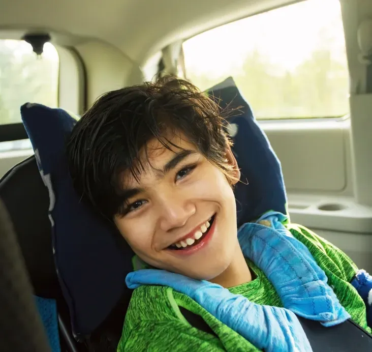 A Smiling Boy In A Car — Ani's Care Pty Ltd In Millner, NT
