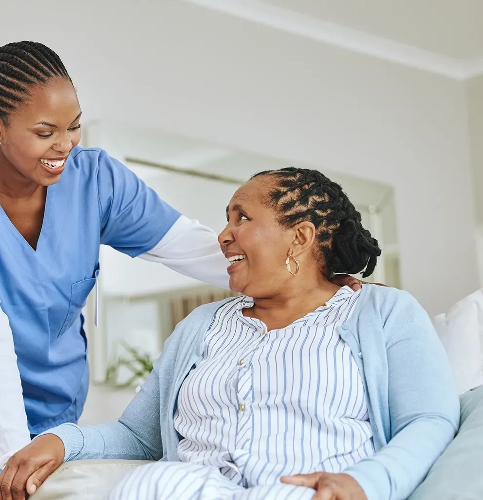 A Carer Helping A Woman Smiling — Ani's Care Pty Ltd In Millner, NT