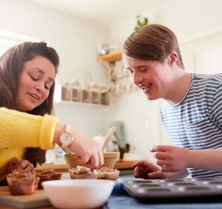 Couple Making Cupcakes in a Kitchen — Ani's Care Pty Ltd In Millner, NT