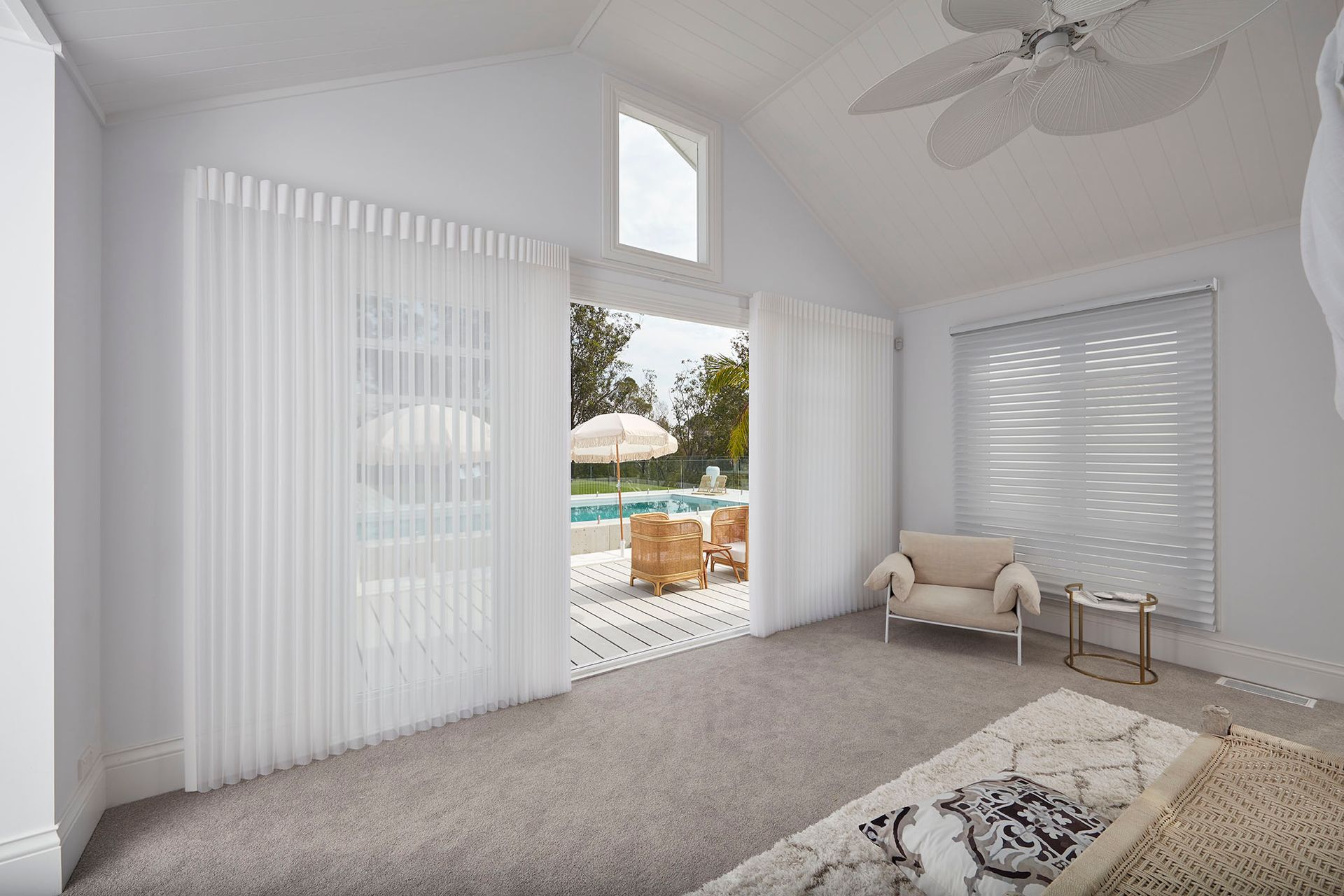 white Vertical Blinds On A Tile Floor And With Sun Peeking In From Behind The Cat — BlindDESIGN In Byron Bay NSW
