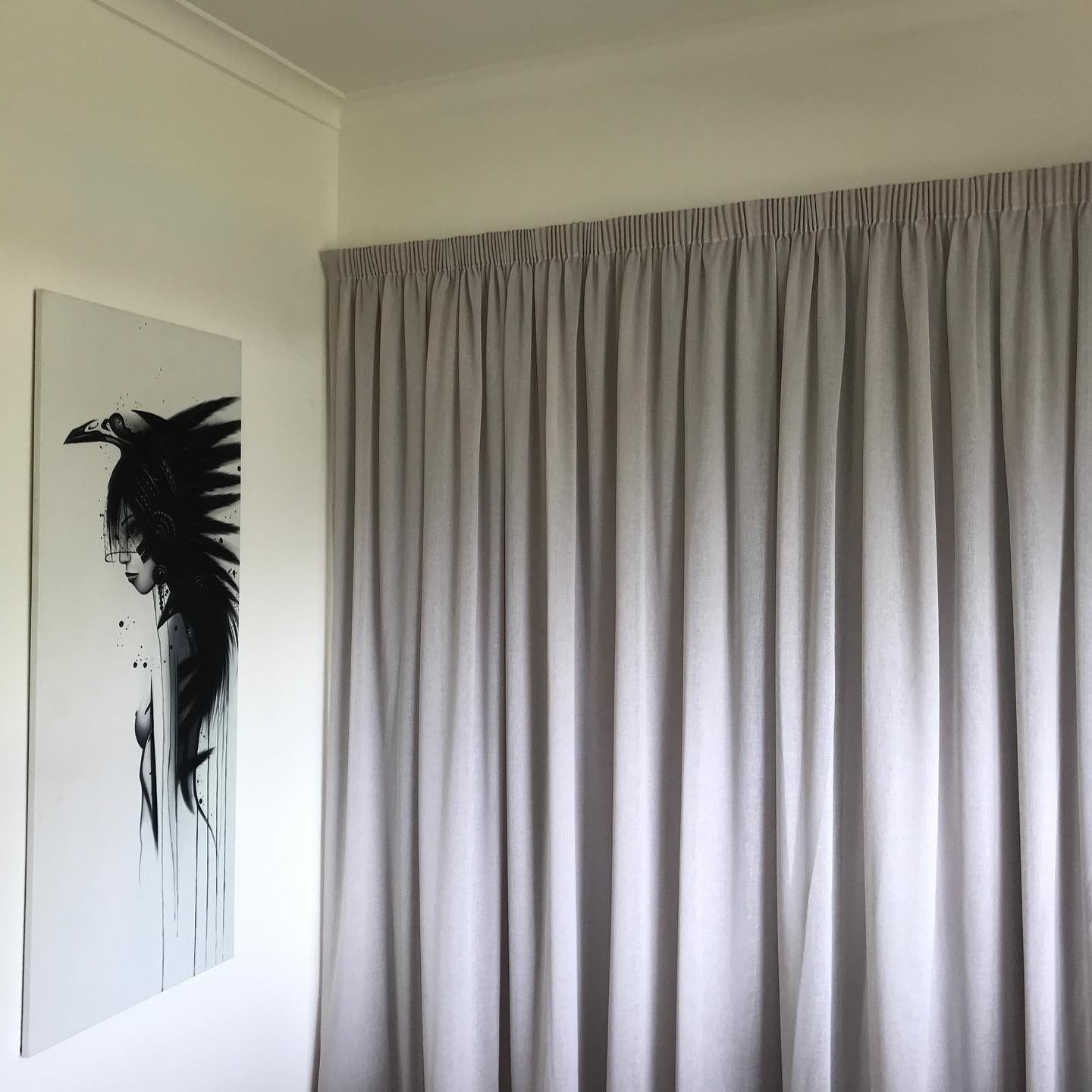 Minimalist Room Features Pale Gray Curtains