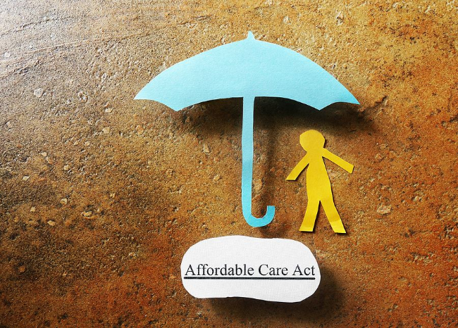 Blue umbrella protecting a yellow figure; 