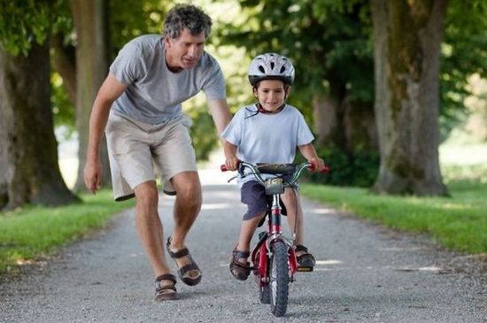 Dad and Son Riding Bike