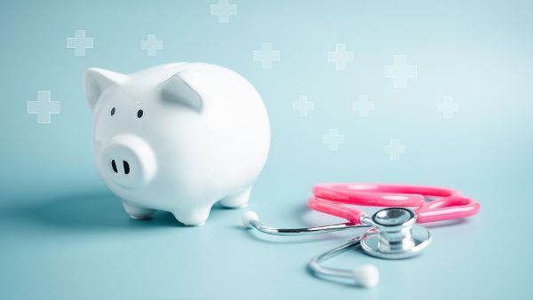 A piggy bank with a stethoscope attached to it.