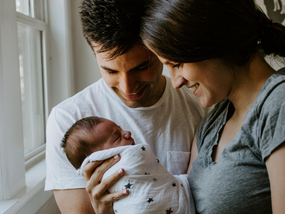 Family holding newborn baby