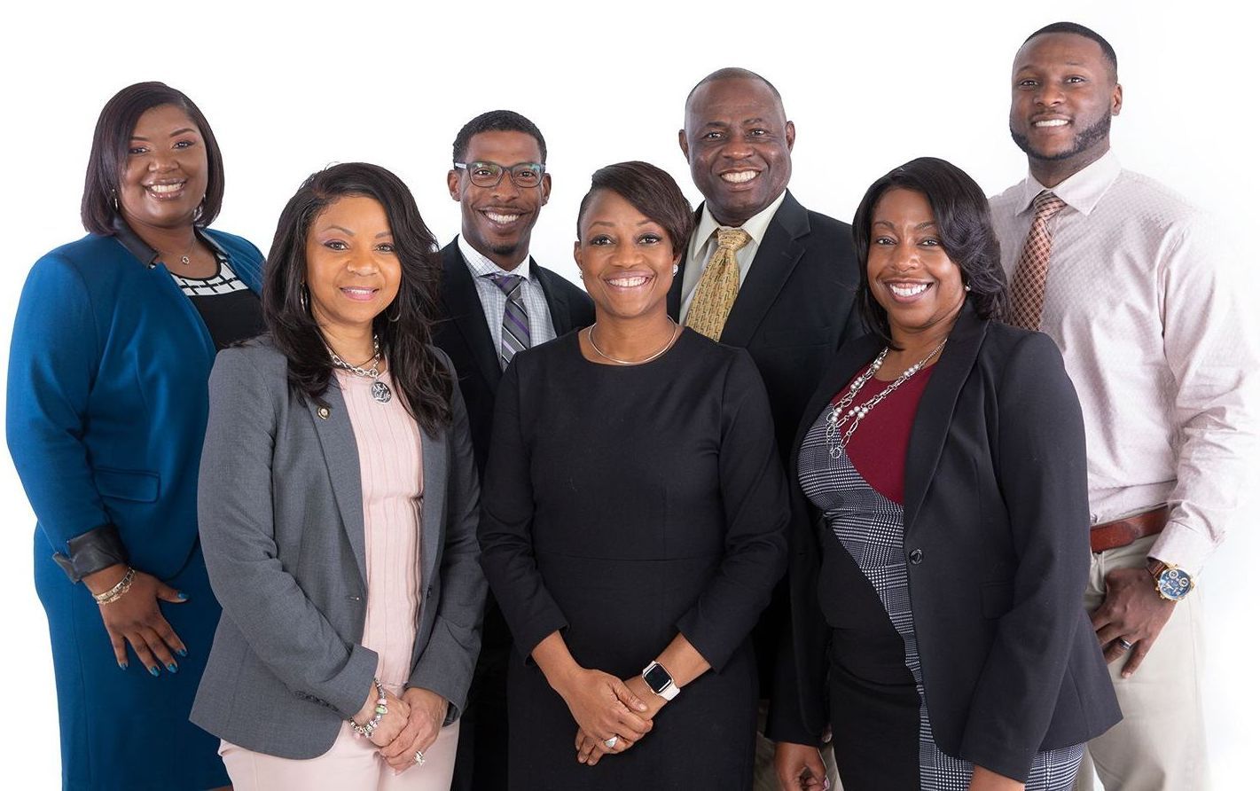 A group of people are posing for a picture together.