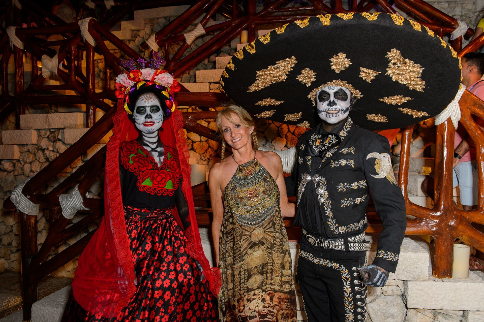 A man dressed as a skeleton stands next to a woman dressed as a bride