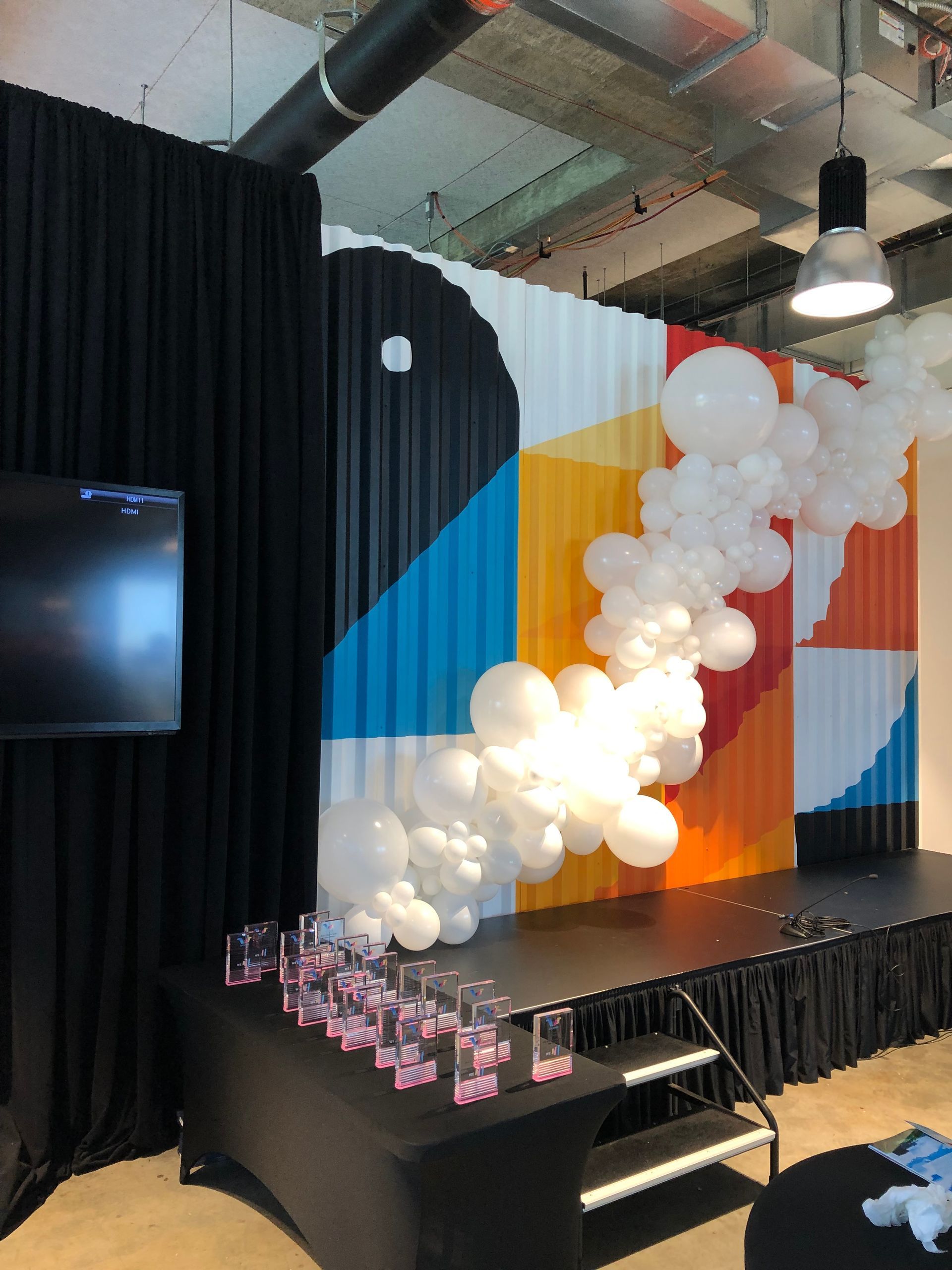 a stage with a bunch of balloons on it