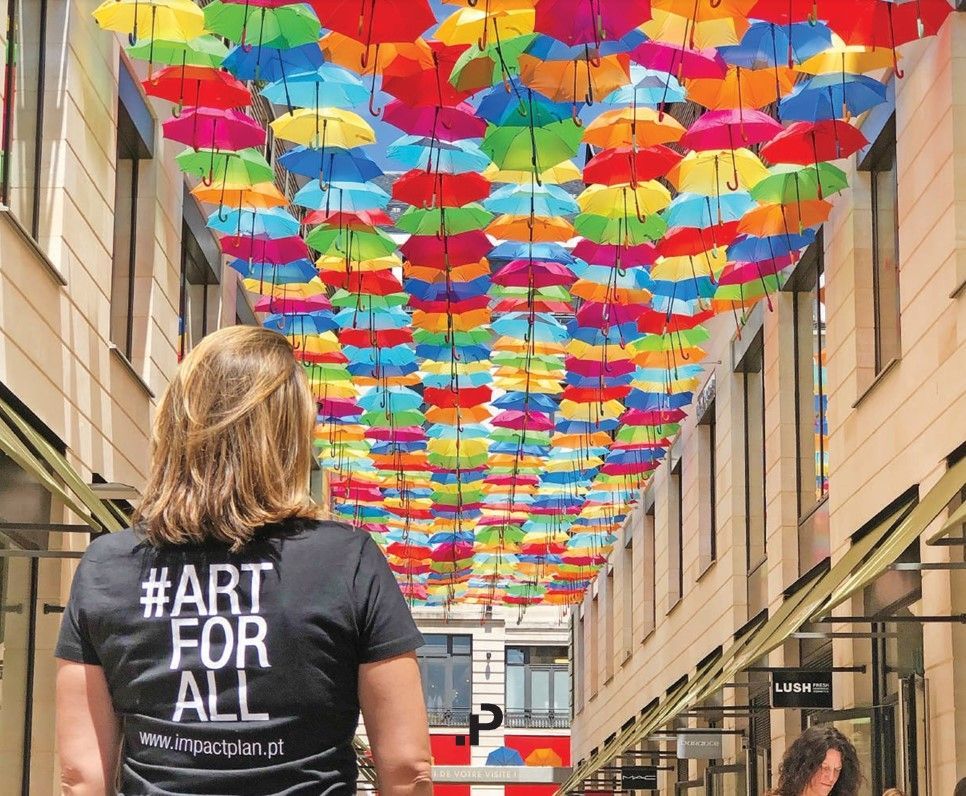 a woman wearing a black shirt that says #art for all