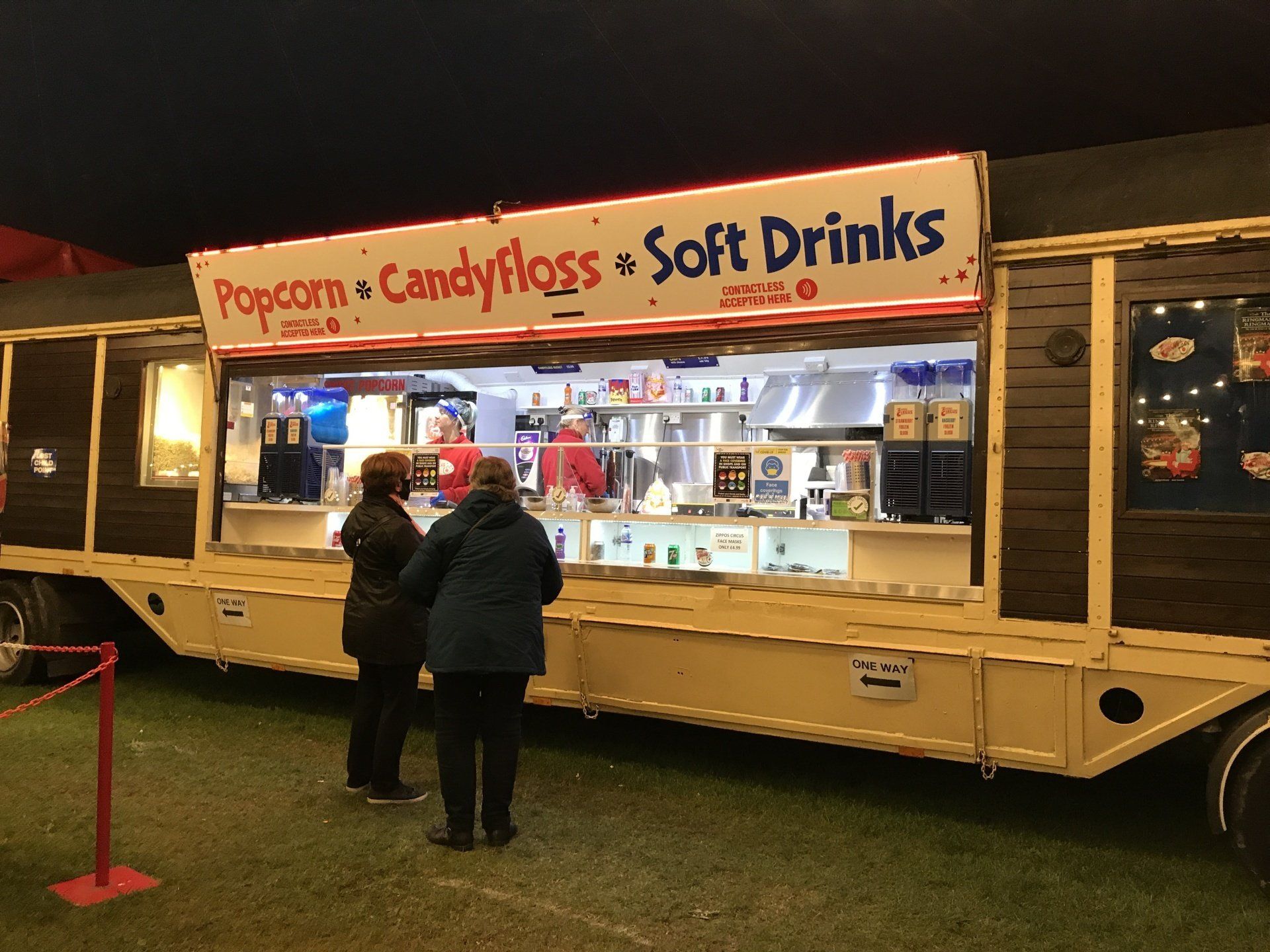 A food truck selling popcorn candy floss and soft drinks