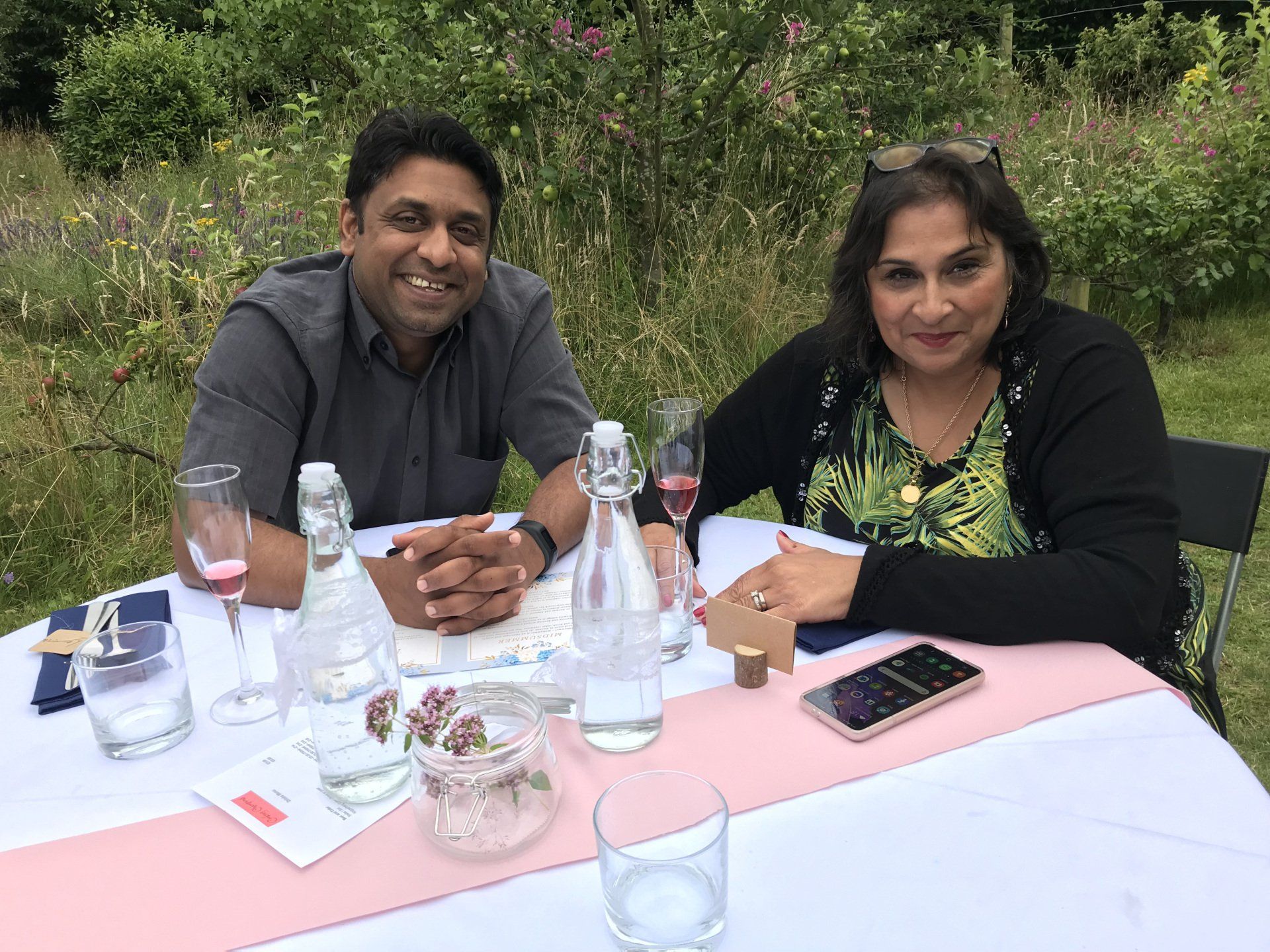 A man and a woman are sitting at a table.
