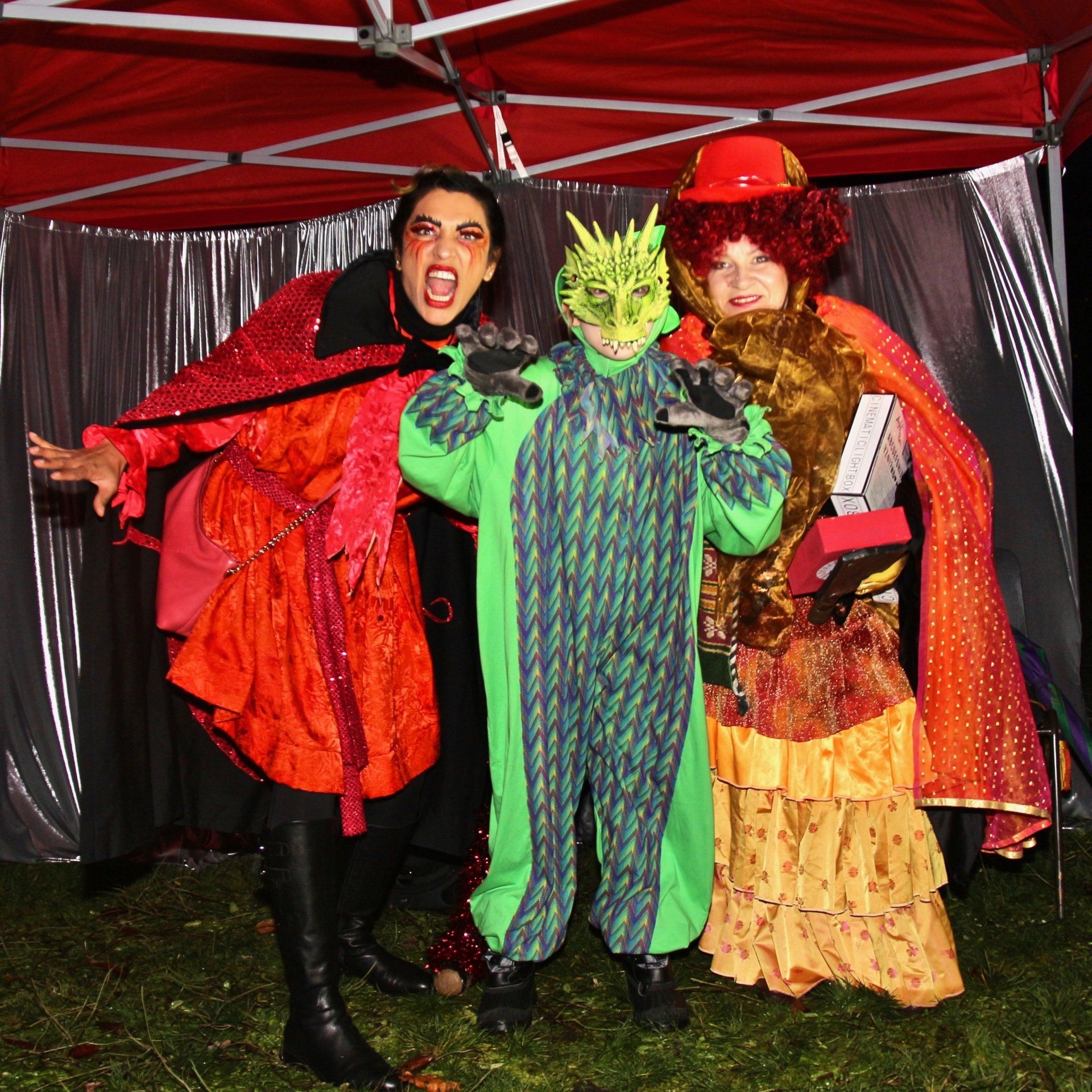 A group of people dressed in costumes pose for a picture