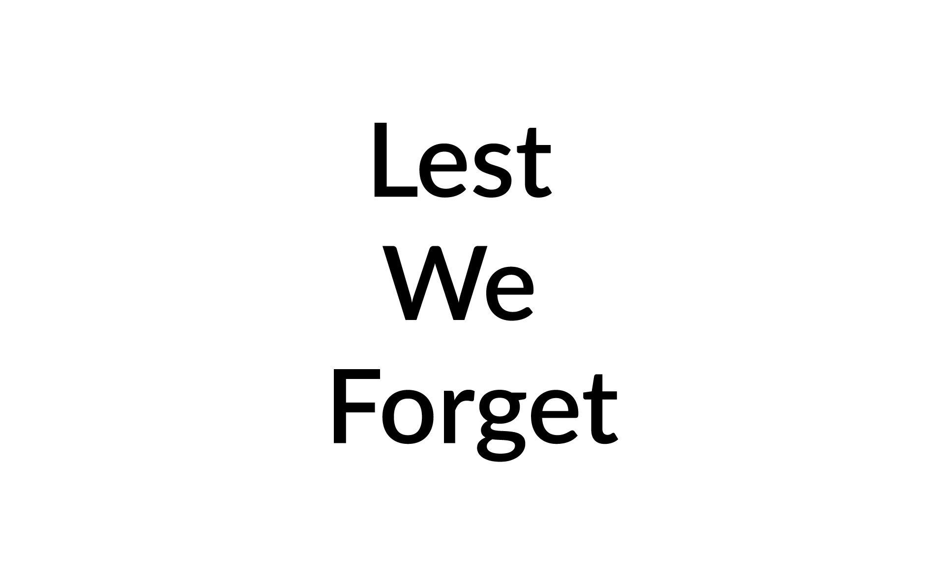 A sign that says `` lest we forget '' on a white background.