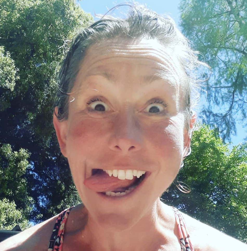 A woman with her tongue out making a funny face