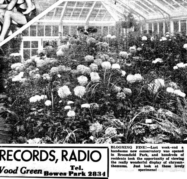 A black and white photo of a garden with flowers and a sign that says records radio