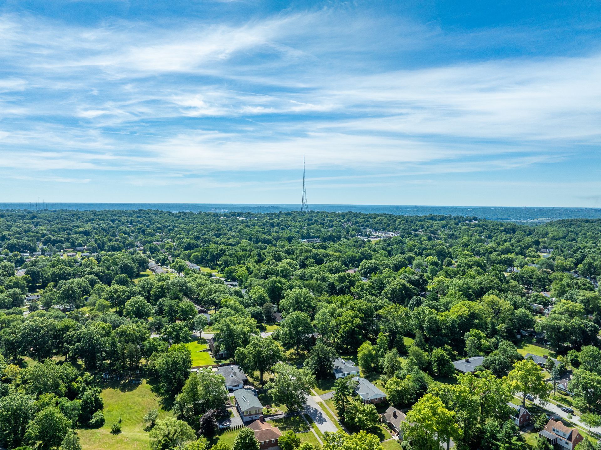 A dining room with a round table and chairs.