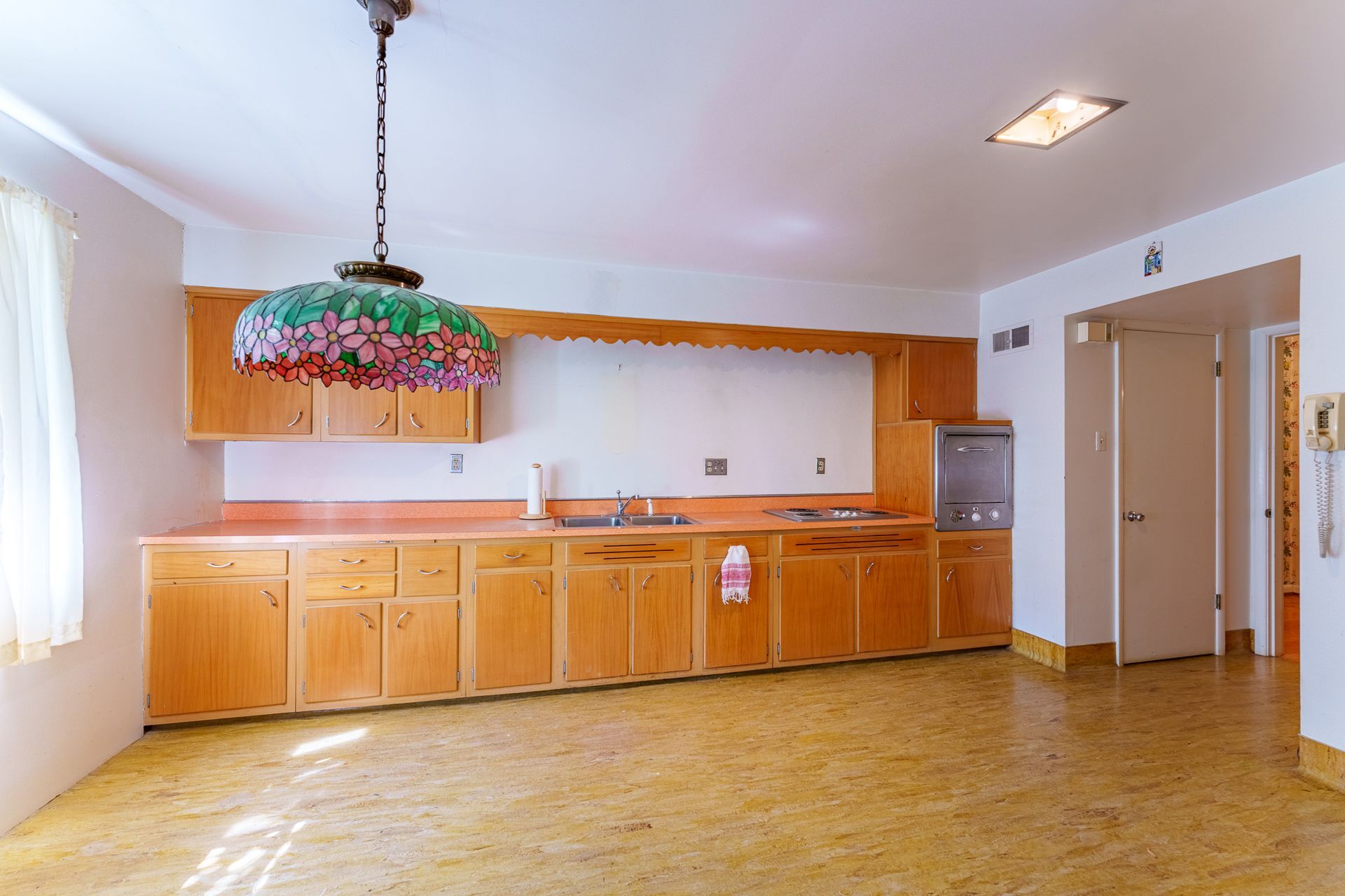 A patio with a lot of furniture and lights at night.