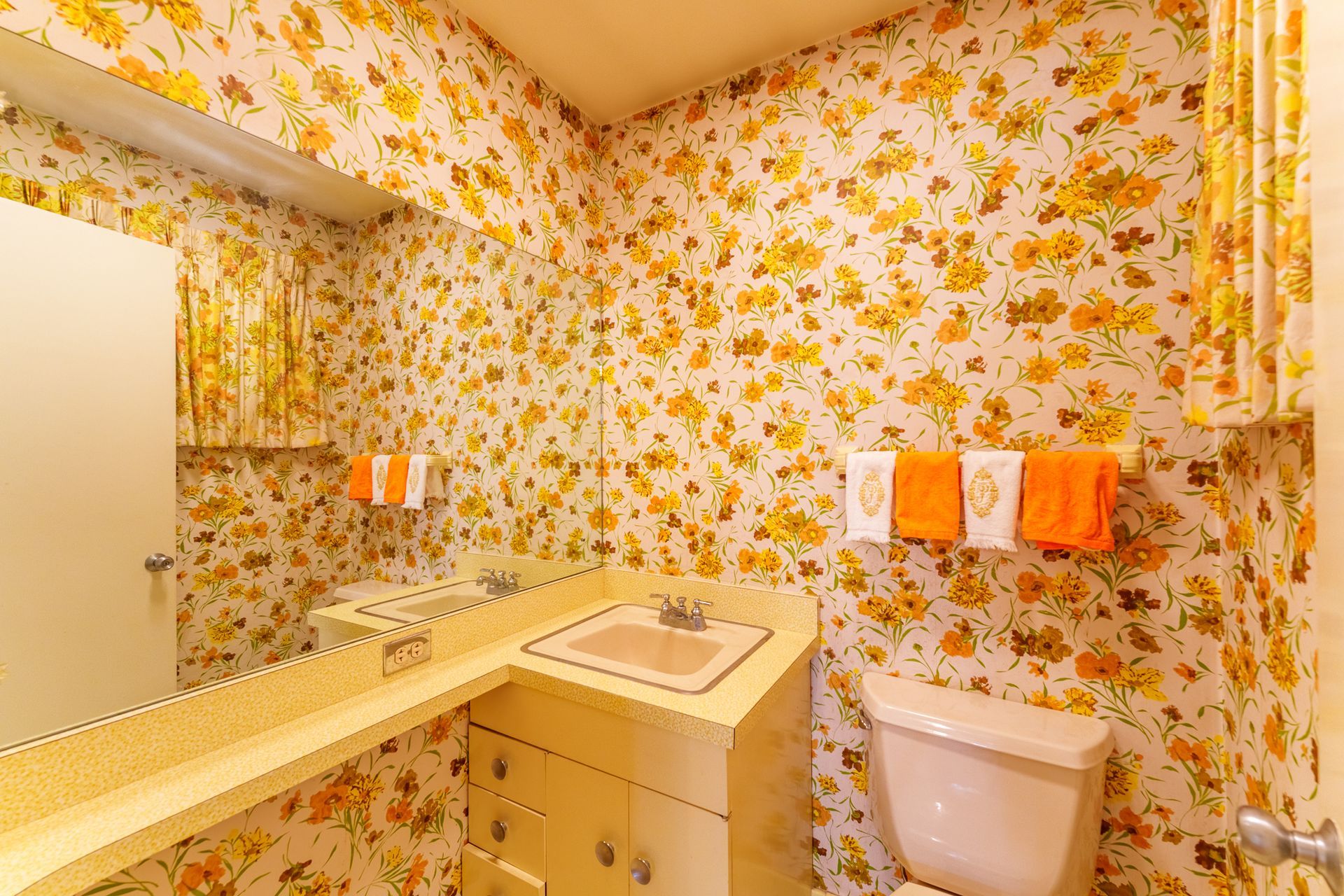 A vase of flowers is sitting on a table next to a window.