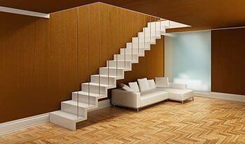 White Stairs and Sofa in an Open Room — Flooring in Verona, PA