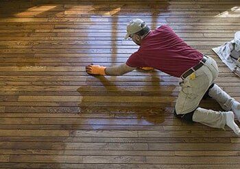 Man waxing the Wooden Floor — Flooring in Verona, PA