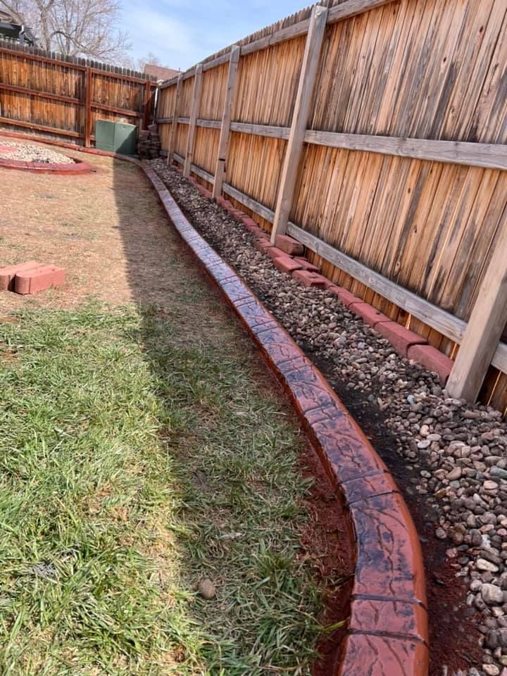 Wooden Fence with a Concrete Curb — Centennial, CO — Colorado Curbing & Landscape