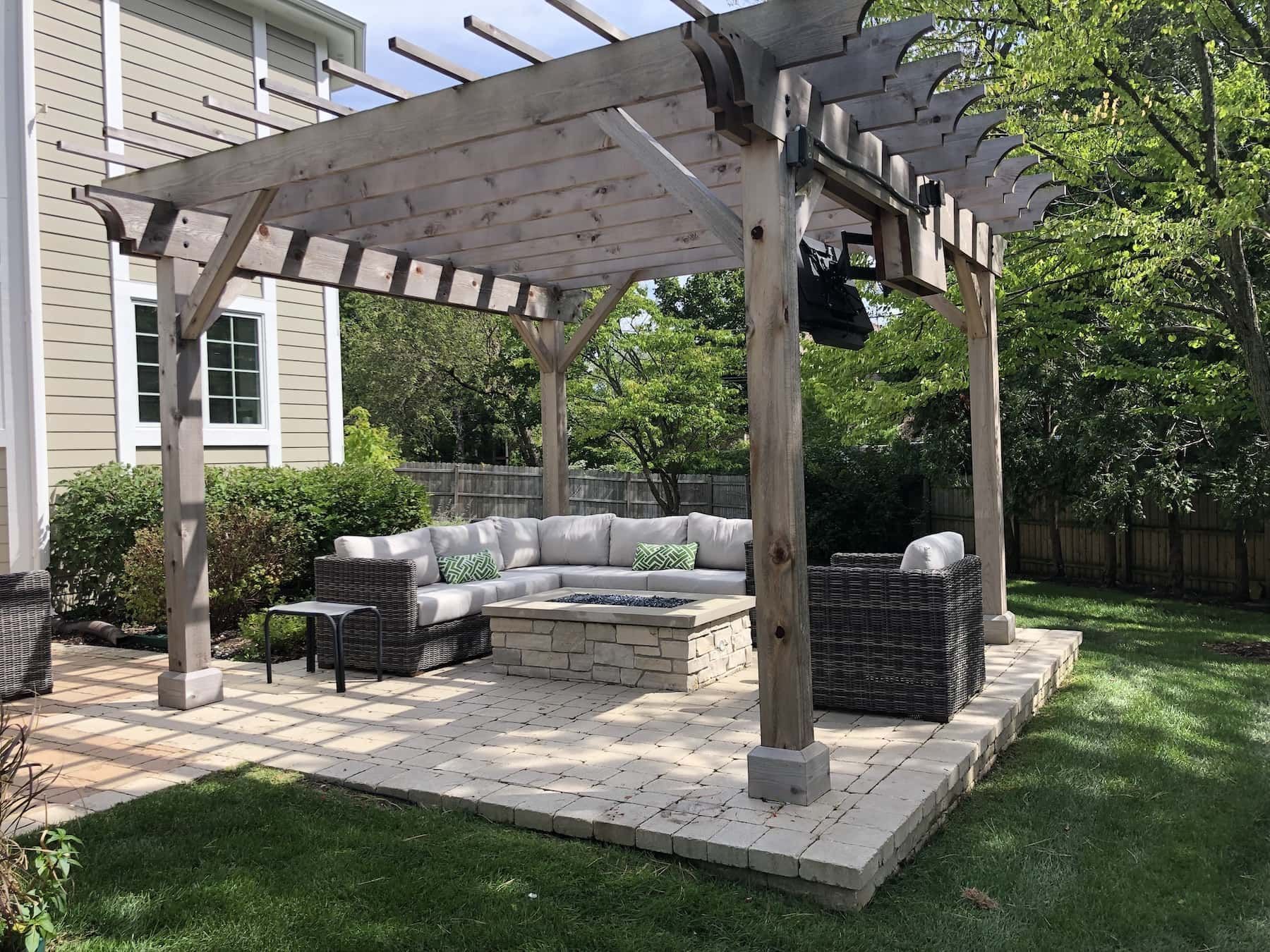 Pergola in the Backyard with a Couch and Chairs — Centennial, CO — Colorado Curbing & Landscape