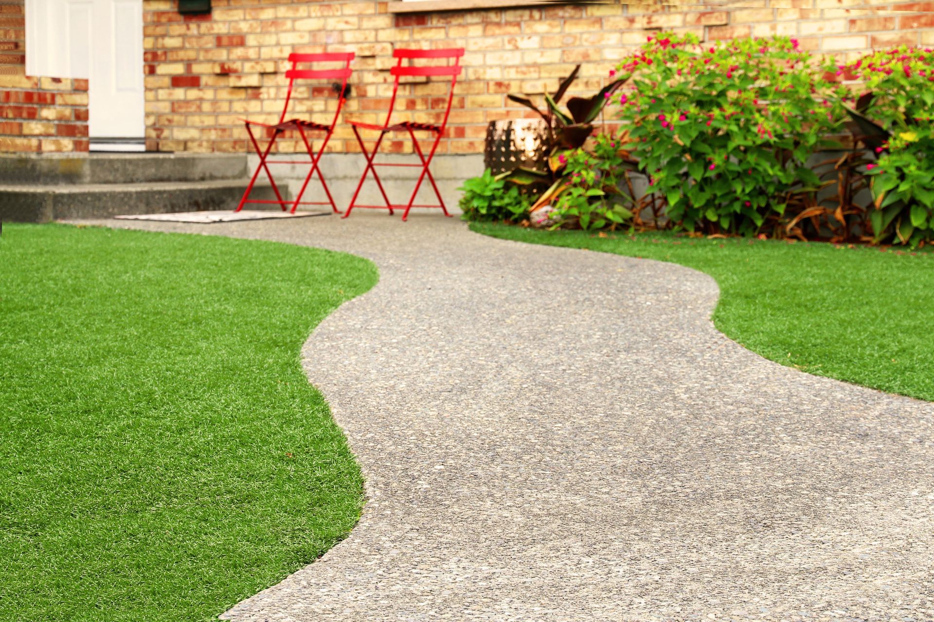 Walkways with natural grass and artificial turf, showcasing landscape installation excellence.