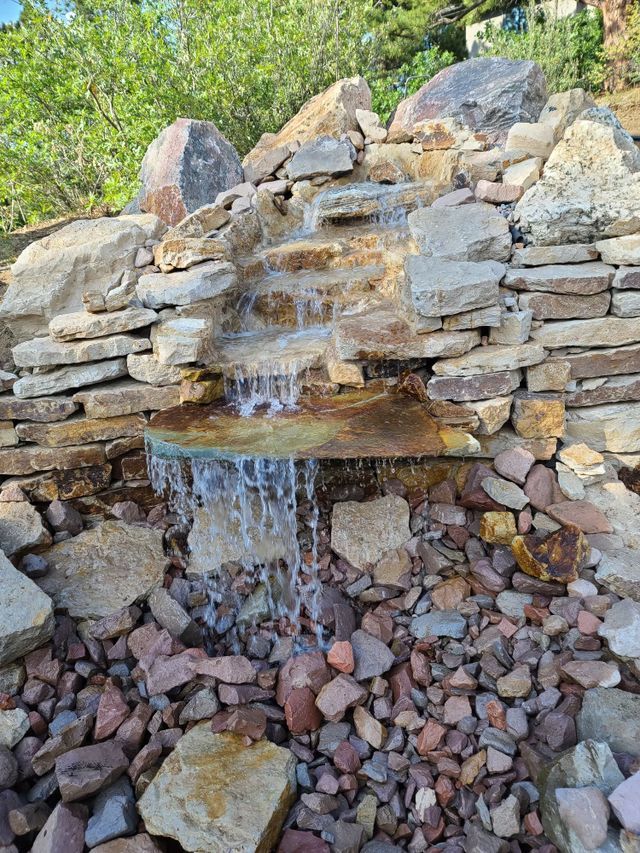 Waterfall in the Middle of a Rock Wall — Centennial, CO — Colorado Curbing & Landscape