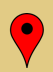 A red map pin icon with a black center on a light tan background.
